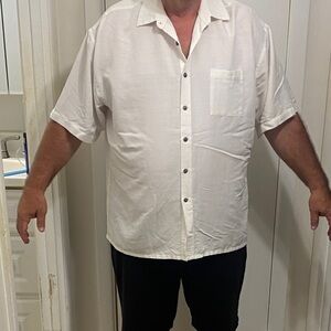 Three mens XXL button down shirts. Excellent condition. One shirt Tommy Bahama.